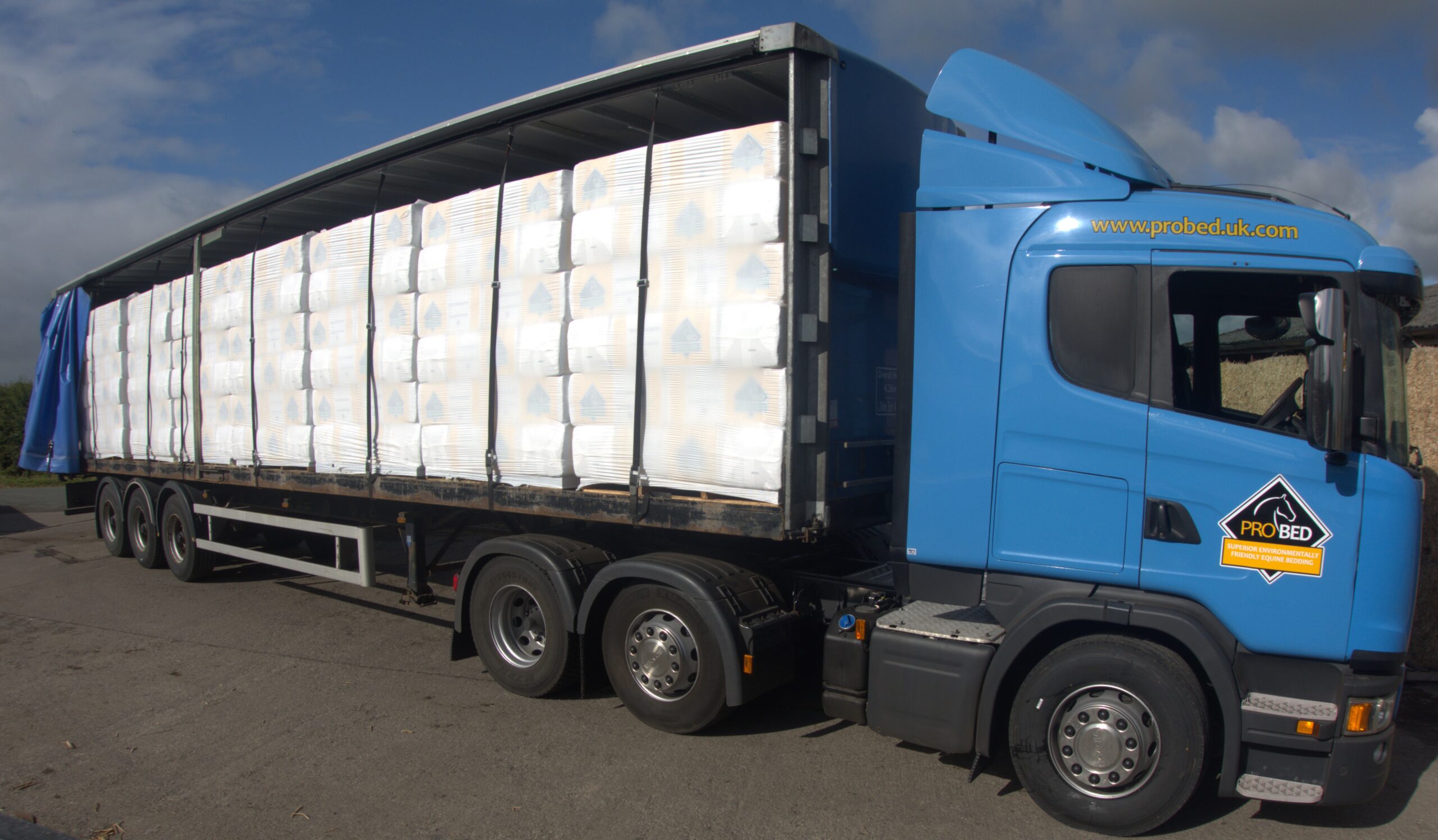 ProBed lorry loaded with bales of bedding